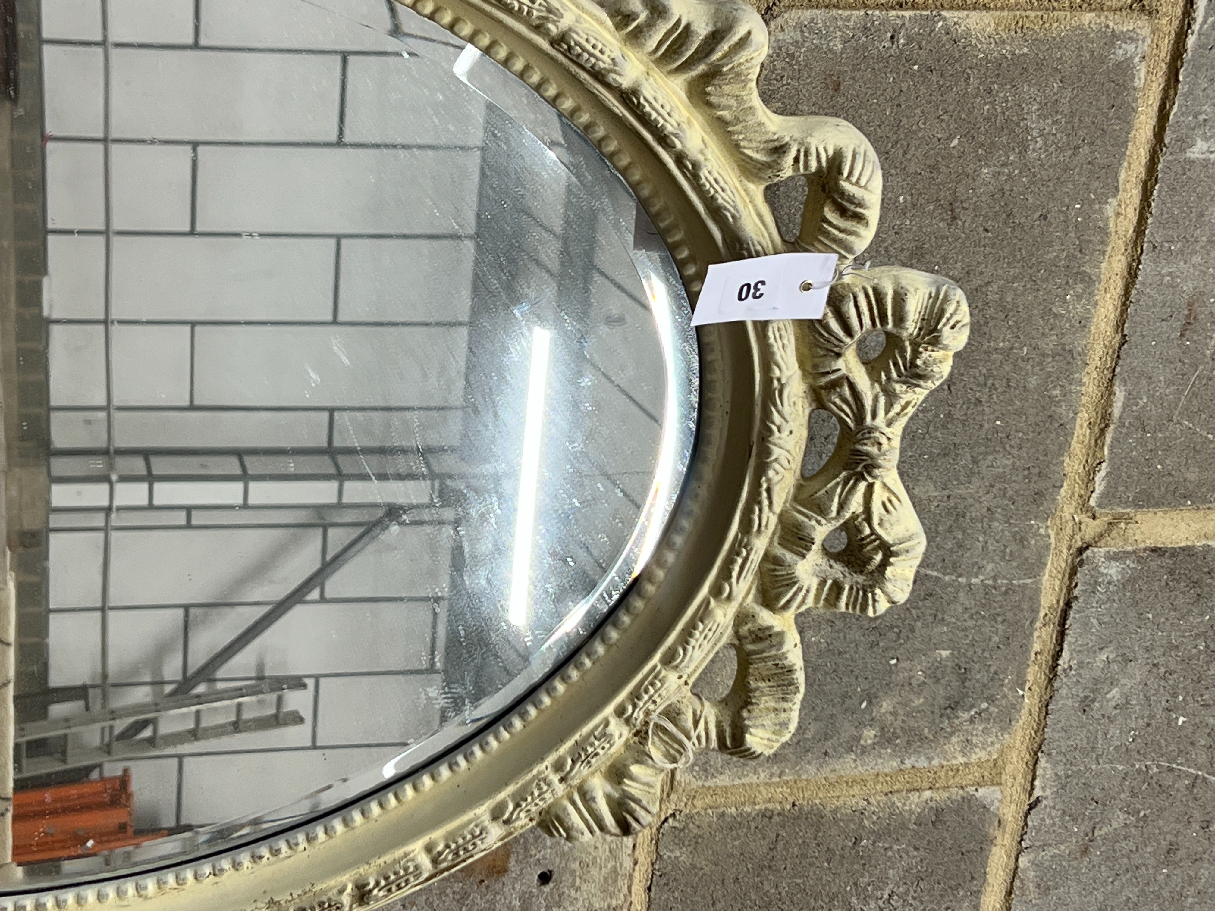 A Victorian style oval painted wall mirror, width 58cm, height 84cm